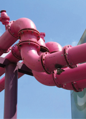 Pink gas pipes running above a street in Berlin